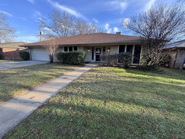 single story home featuring a garage and a front yard