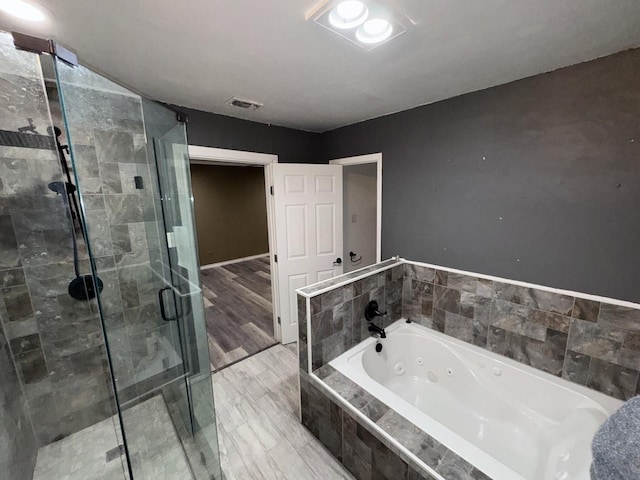 bathroom featuring plus walk in shower