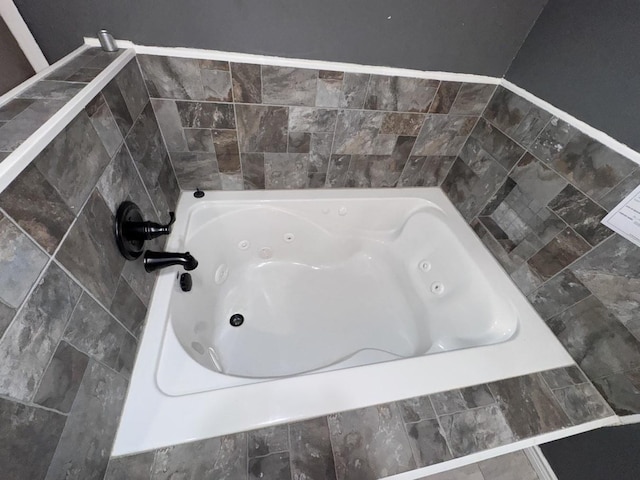 bathroom with tiled tub