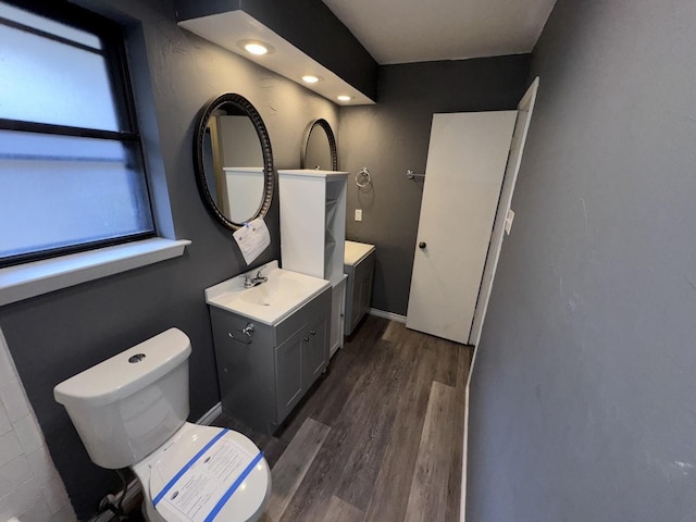 bathroom featuring vanity and hardwood / wood-style floors