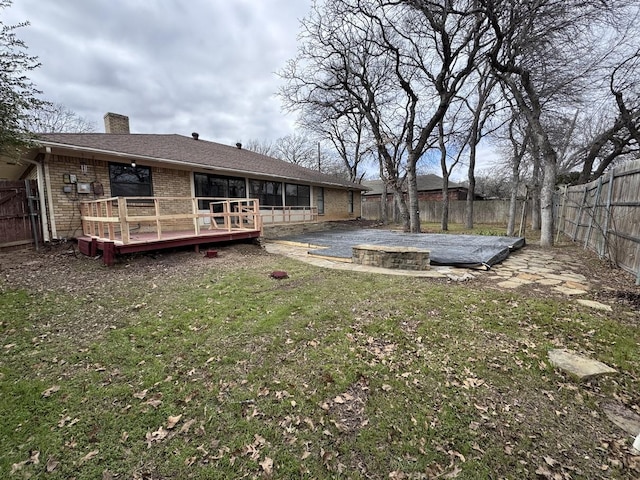 view of yard featuring a deck and a patio area