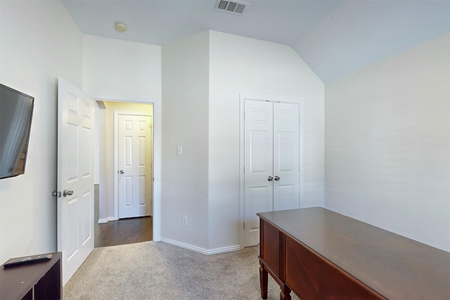 office area with lofted ceiling and carpet floors