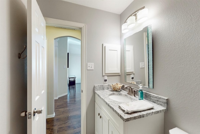 bathroom featuring vanity and hardwood / wood-style floors