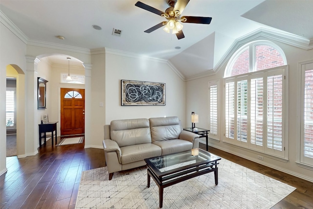 living room with ornamental molding, lofted ceiling, dark hardwood / wood-style floors, and ornate columns