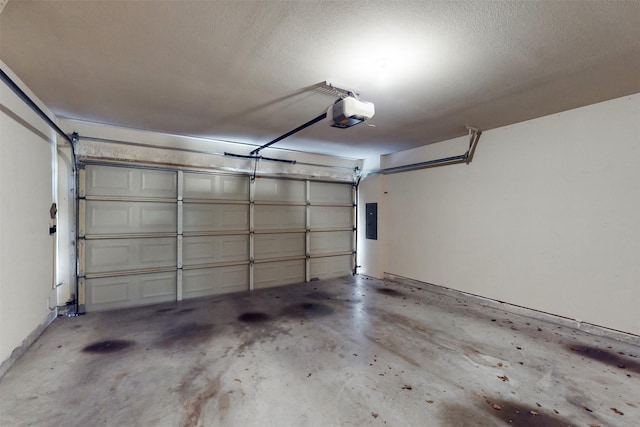 garage featuring a garage door opener and electric panel