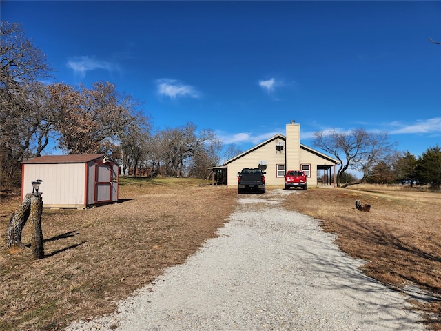 view of property exterior with a storage shed