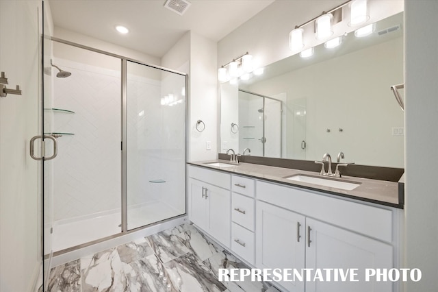 bathroom with vanity and an enclosed shower