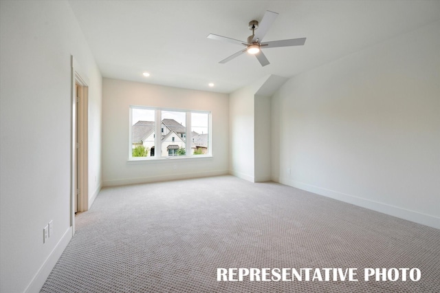 interior space featuring light colored carpet and ceiling fan