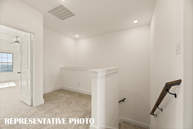 spacious closet with light colored carpet