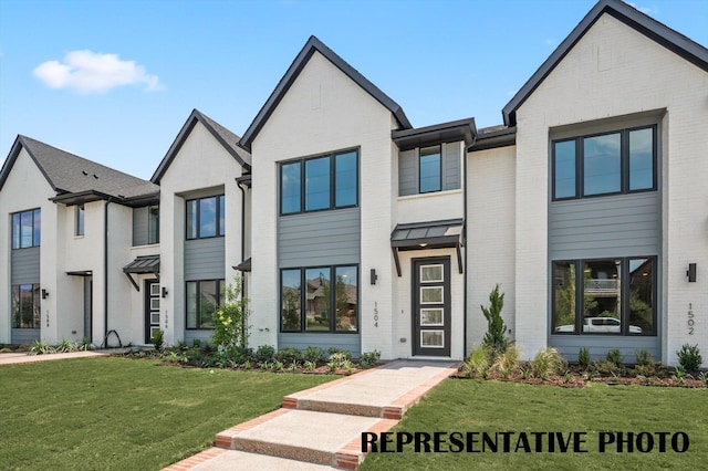 view of front of property with a front lawn