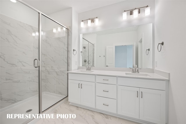 bathroom with a shower with door and vanity