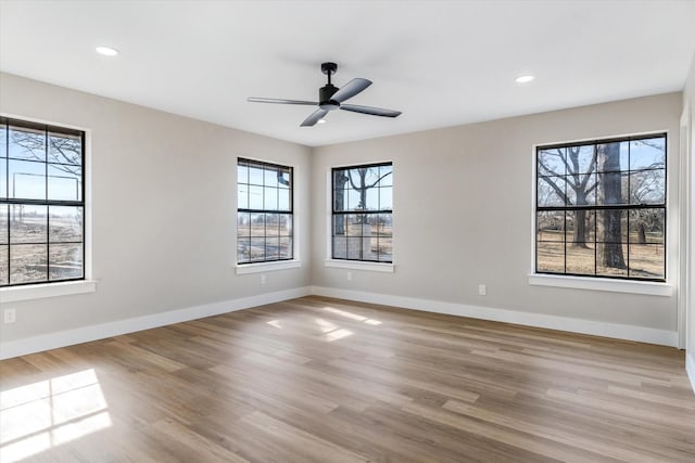 unfurnished room featuring ceiling fan and light hardwood / wood-style flooring