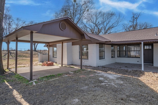 view of property exterior with a patio