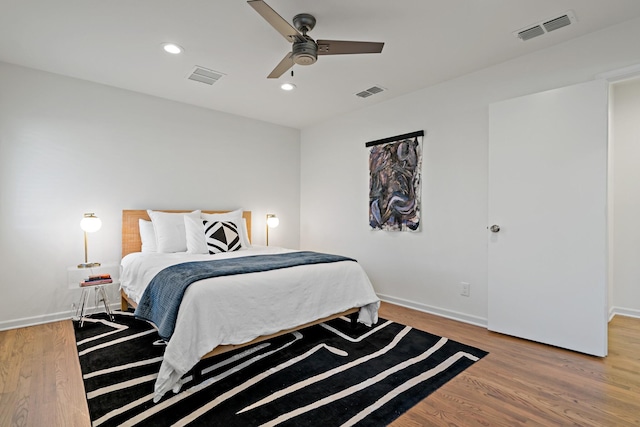 bedroom with hardwood / wood-style flooring and ceiling fan