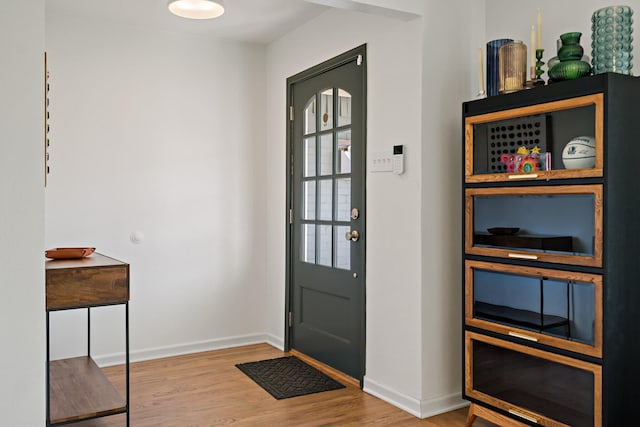 doorway featuring wood-type flooring