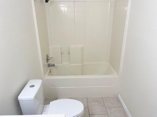 bathroom featuring bathtub / shower combination, toilet, and tile patterned flooring