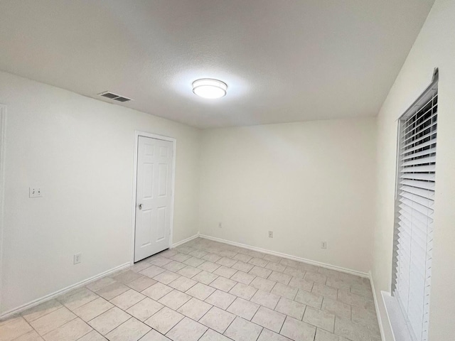 unfurnished bedroom with a textured ceiling