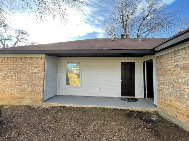 property entrance with a patio area