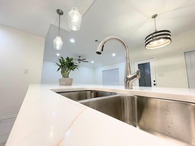 interior details with hanging light fixtures and sink