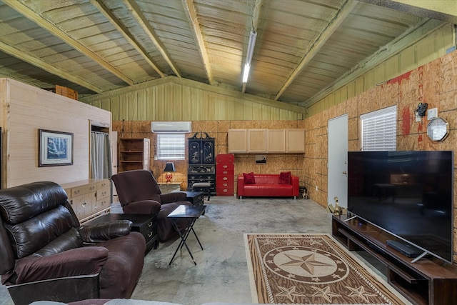 living room with a wall mounted air conditioner, a wealth of natural light, lofted ceiling with beams, and concrete floors