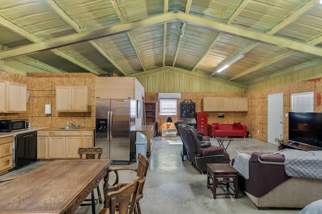 living room featuring lofted ceiling and sink