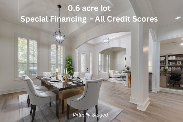 dining space with an inviting chandelier, crown molding, and light hardwood / wood-style flooring