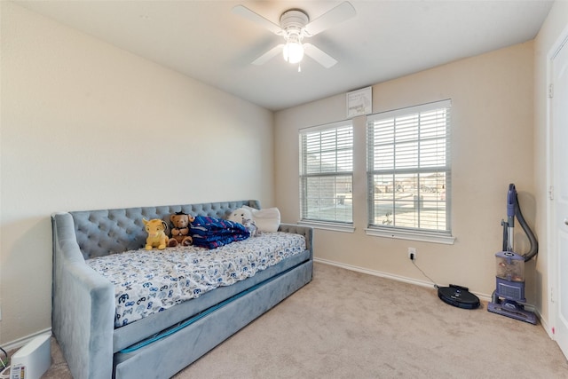 bedroom with light carpet and ceiling fan