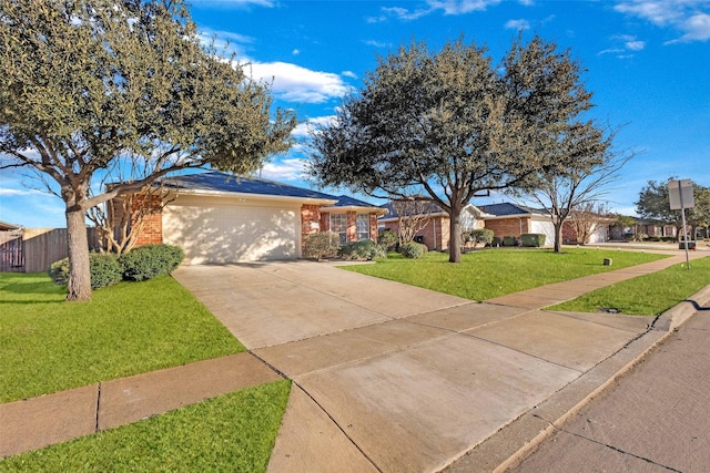 ranch-style home featuring a garage and a front yard