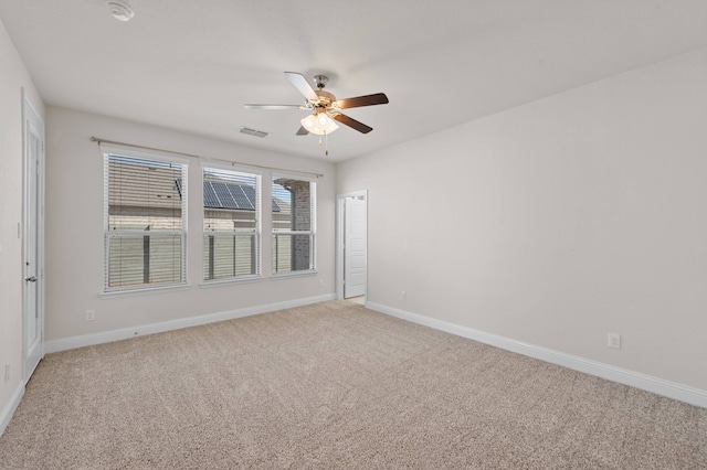 carpeted empty room with ceiling fan