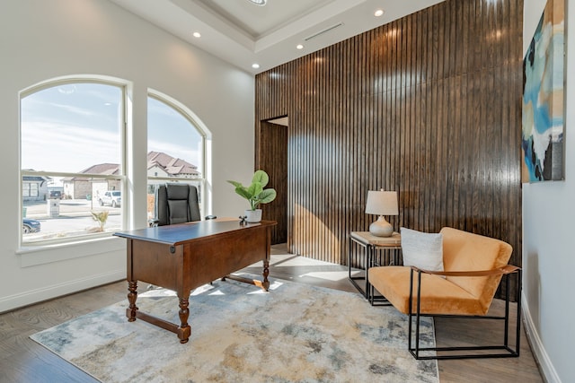 home office with light hardwood / wood-style flooring