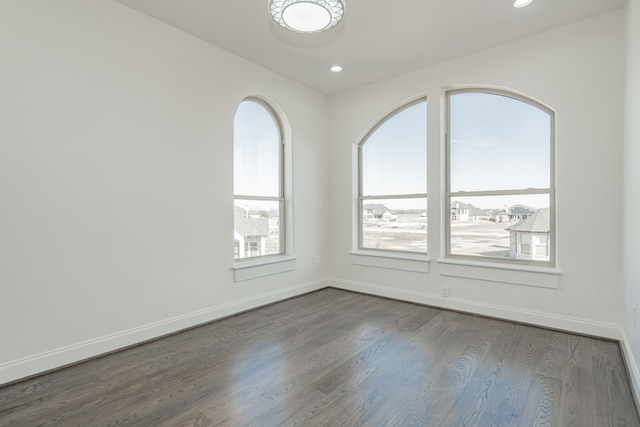 spare room featuring hardwood / wood-style flooring