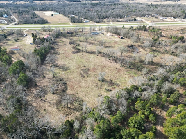 birds eye view of property with a rural view