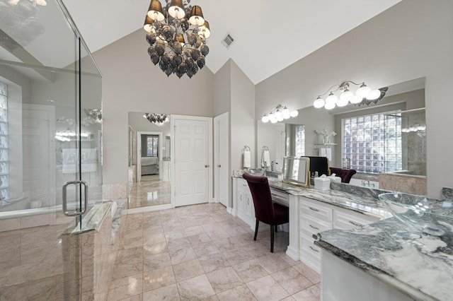 bathroom featuring high vaulted ceiling, vanity, a chandelier, and a shower with door