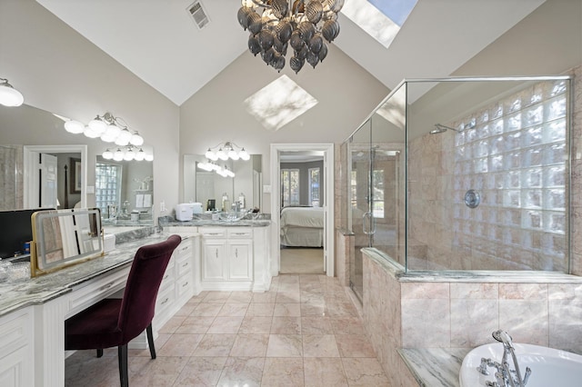 bathroom with vanity, high vaulted ceiling, and independent shower and bath