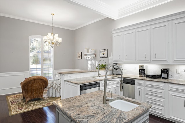 kitchen with sink, light stone counters, a center island with sink, dishwasher, and white cabinets