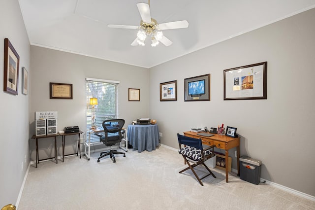 carpeted office space with ceiling fan