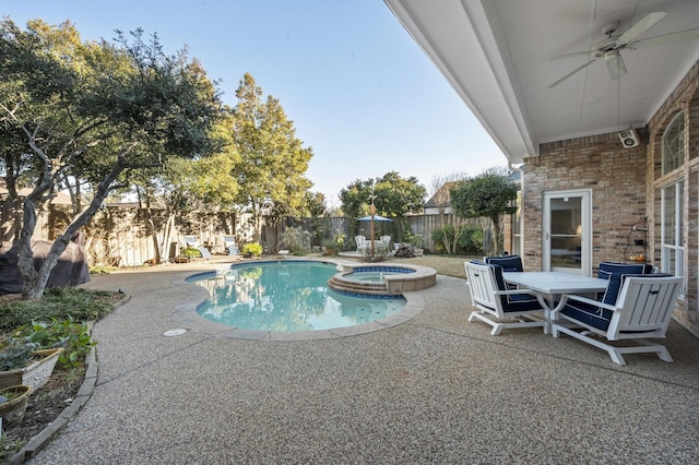 view of swimming pool featuring a patio, ceiling fan, and an in ground hot tub