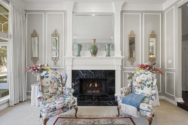 sitting room with light carpet, a high end fireplace, and ornamental molding