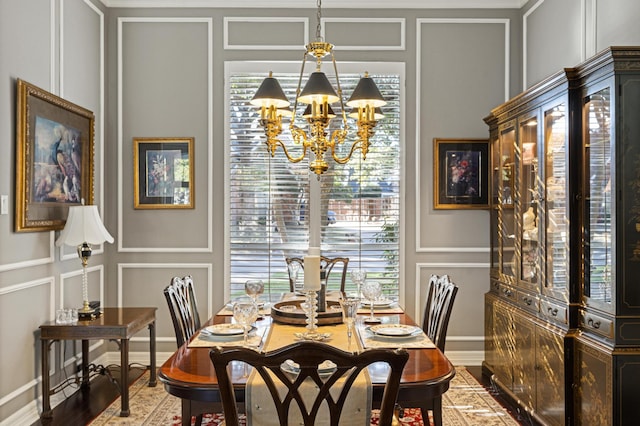 dining area featuring a notable chandelier