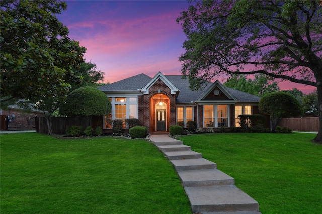 view of front of property with a yard