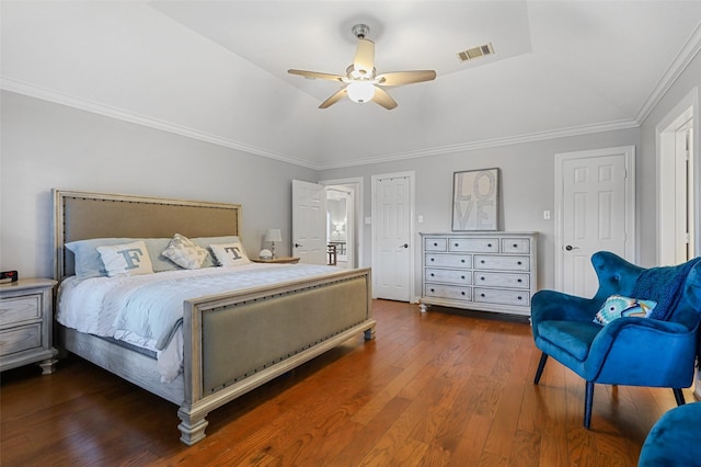 bedroom with dark hardwood / wood-style flooring, vaulted ceiling, ornamental molding, and ceiling fan