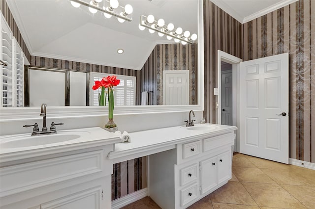 bathroom featuring vanity, vaulted ceiling, and ornamental molding