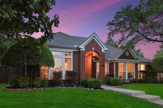 view of front of house with a lawn