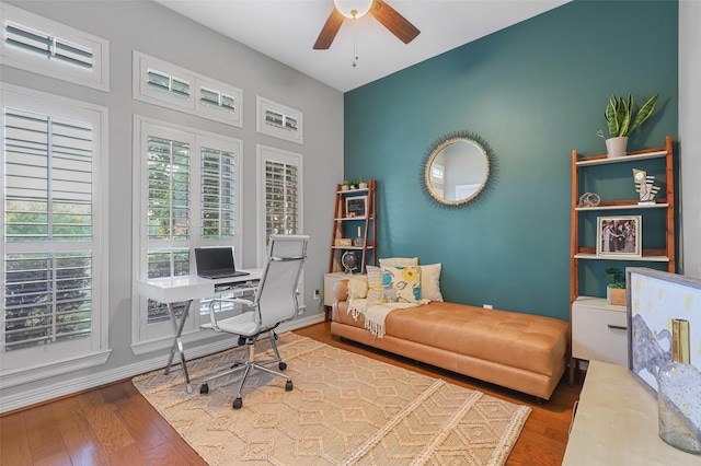 office space with ceiling fan and dark hardwood / wood-style flooring