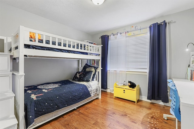 bedroom with light hardwood / wood-style floors