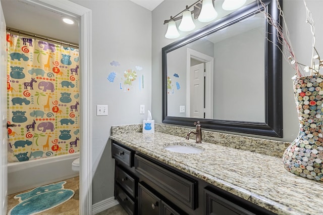 full bathroom with vanity, shower / tub combo, and toilet