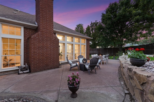 view of patio terrace at dusk