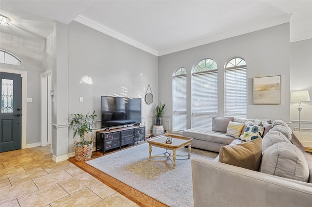 living room featuring light tile patterned floors and crown molding