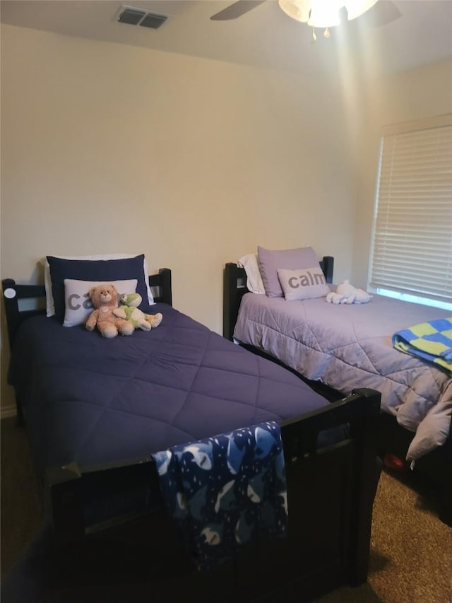 bedroom featuring ceiling fan and carpet flooring