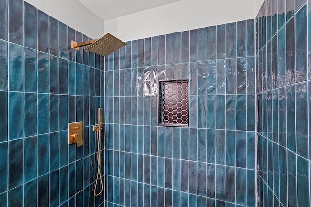 bathroom with a tile shower